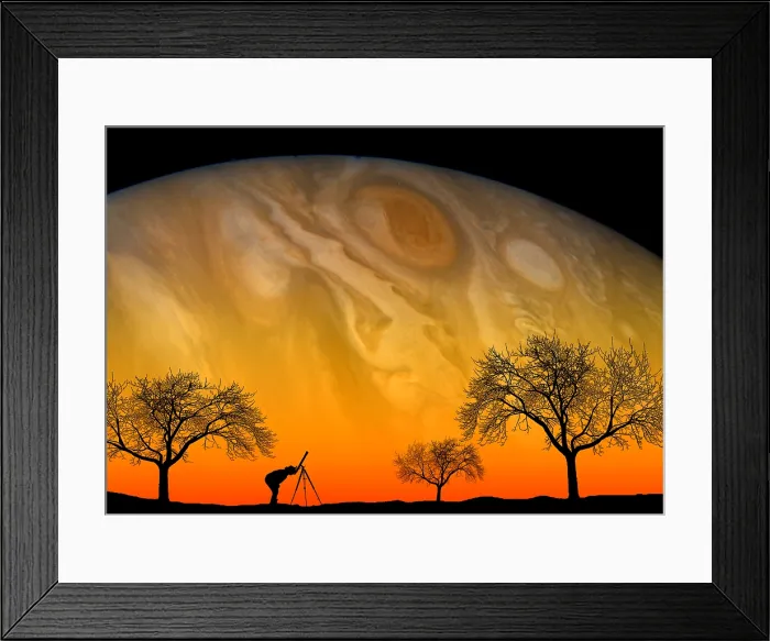 Framed Print : Astronomy. In this composite photo, an amateur astronomer gazes at the Framed Print : Astronomy. In this composite photo, an amateur astronomer gazes at the
