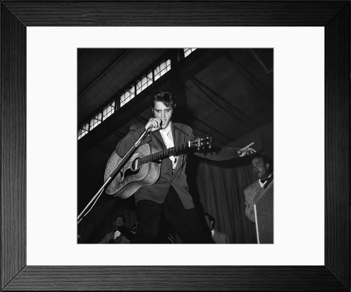 Framed Print : Elvis. American singer Elvis Presley (1935 - 1977) performs with trademark Framed Print : Elvis. American singer Elvis Presley (1935 - 1977) performs with trademark