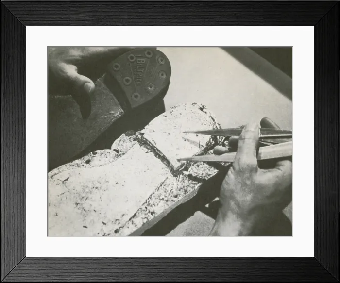 Framed Print : Forensics. Historic image of a police officer comparing a suspect's shoe