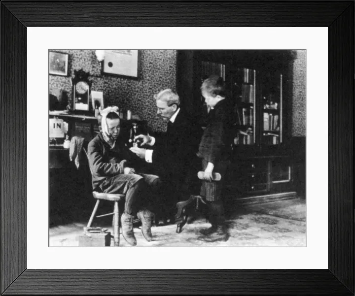 Framed Print : Doctor Treating Boy, 1900 Framed Print : Doctor Treating Boy, 1900