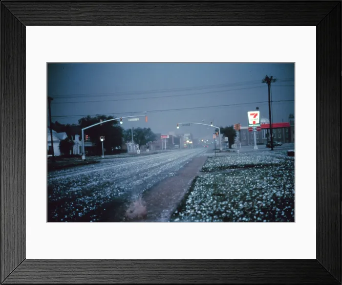 Framed Print : Hail. Large hail collects on streets and grass during severe thunderstorm Framed Print : Hail. Large hail collects on streets and grass during severe thunderstorm