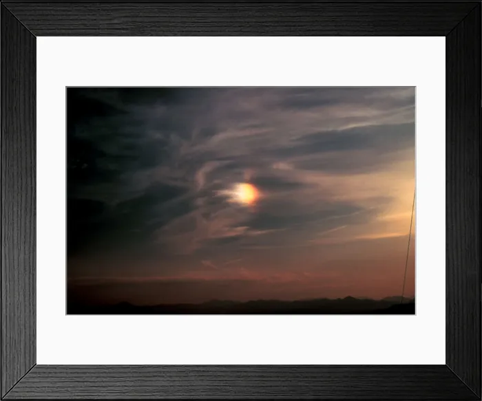 Framed Print : Sun Dog. Parhelion or 'sun dog' to the left of the sun Framed Print : Sun Dog. Parhelion or 'sun dog' to the left of the sun