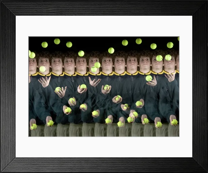 Framed Print : Juggler. Stroboscopic image of a boy juggling three balls