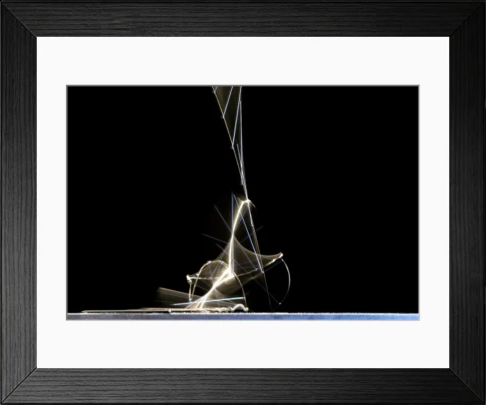 Framed Print : High speed strobe image of pin dropping Framed Print : High speed strobe image of pin dropping