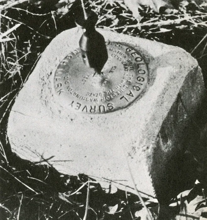 Framed Print : Benchmark. Close up of a benchmark, with a surveyor's plumb-bob visible, hanging above