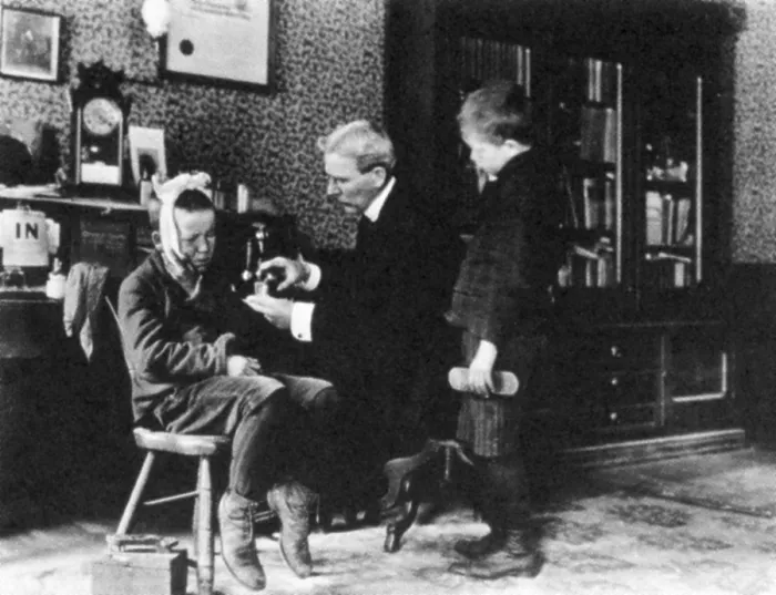 Framed Print : Doctor Treating Boy, 1900 Framed Print : Doctor Treating Boy, 1900