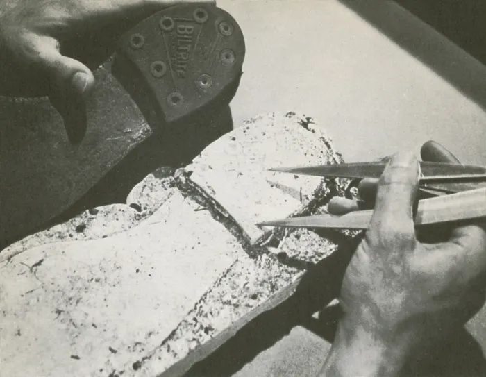 Framed Print : Forensics. Historic image of a police officer comparing a suspect's shoe
