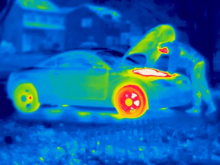 Framed Print : A thermogram of a man working on a car Framed Print : A thermogram of a man working on a car