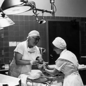 Dr. Apgar with Nurse and Infant Dr. Apgar with Nurse and Infant