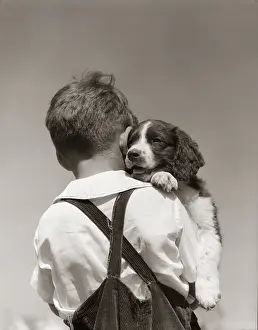 Boy with puppy, c.1930-40s