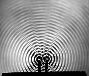 Prints of Two ripple tank probes vibrating at the same frequency generate two circular wave systems which produce the interference pattern shown. Photograph taken between 1958-61 : Circular Interference Wave Pattern, Systems, Physics
