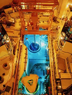 Prints of Reactor defuelling. Discharging fuel from a reactor core to cooling ponds at a pressurized water reactor (PWR) nuclear power station : Core of nuclear plant