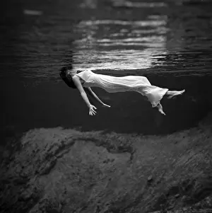 Waters Prints: Fashion Model Floating In Water, 1947