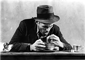 Depressed Prints: Homeless Man Eating in a Soup Kitchen