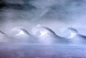 Friction Prints: Kelvin-Helmholtz Wave Clouds