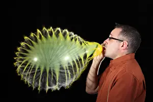 Studio Prints: Man Over-Inflating Balloon