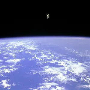 Prints of Mission Specialist Bruce McCandless II, is seen further away from the confines and safety of his ship than any previous astronaut has ever been : STS-41-B, First Untethered Spacewalk, 1984