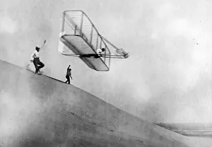 Flying Prints: Wilbur Wright Pilots Early Glider, 1901
