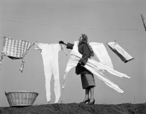 : Woman Removing Frozen Clothes, Vintage Nostalgia